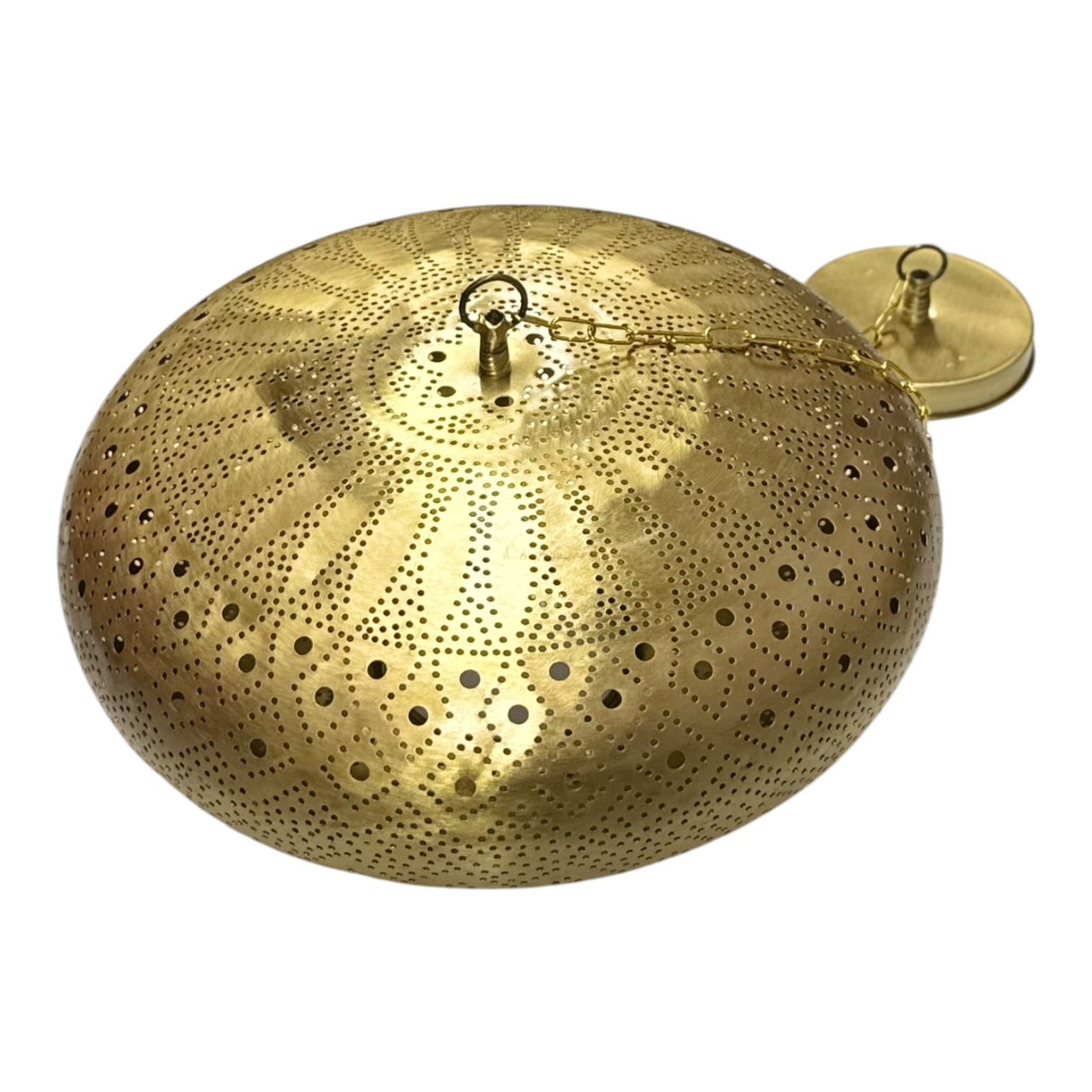 Brass wall-mounted candle holder with textured surface on a white background