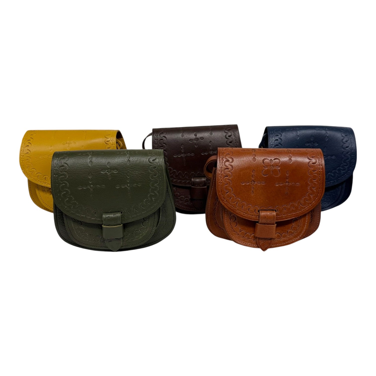 Five leather bags in different colors arranged in a row on a white background