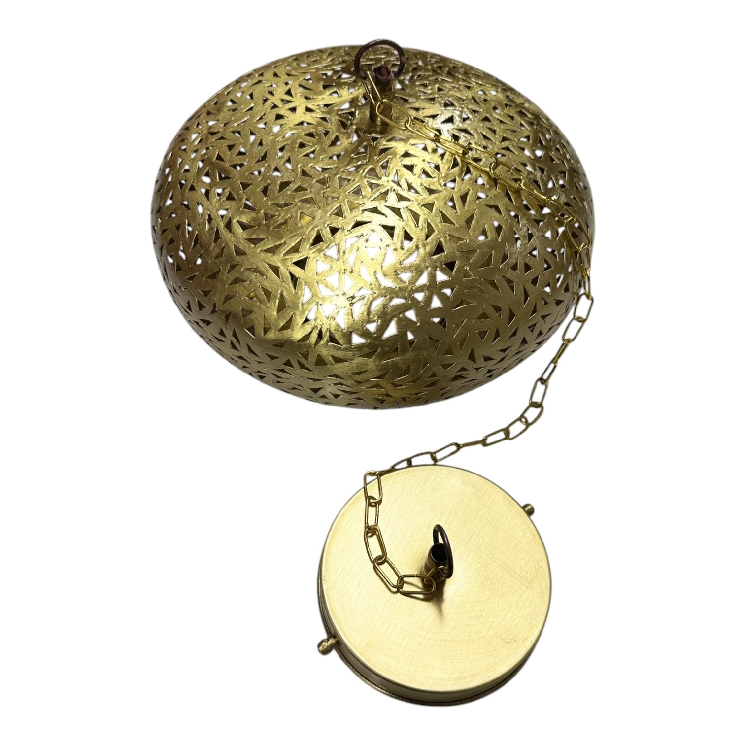 Decorative brass pendant with intricate patterns on a white background