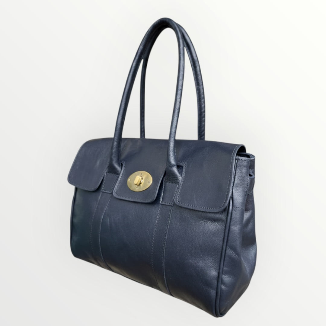 Blue handbag with a gold clasp on a white background