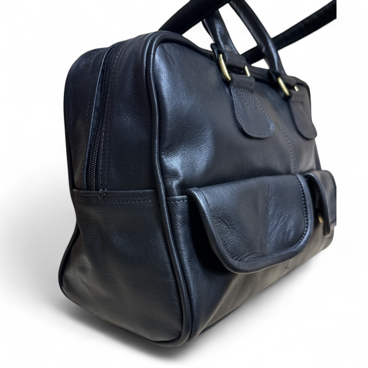Black leather bag with a strap on a white background