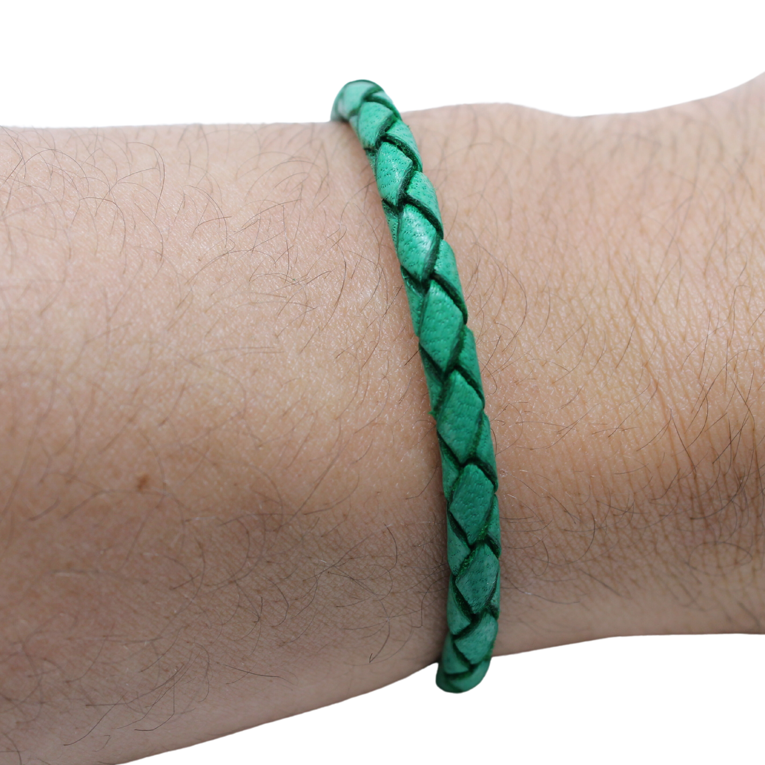Adjustable twisted artisan leather bracelet jewelry for men and women in green on wrist by Artisan Stories