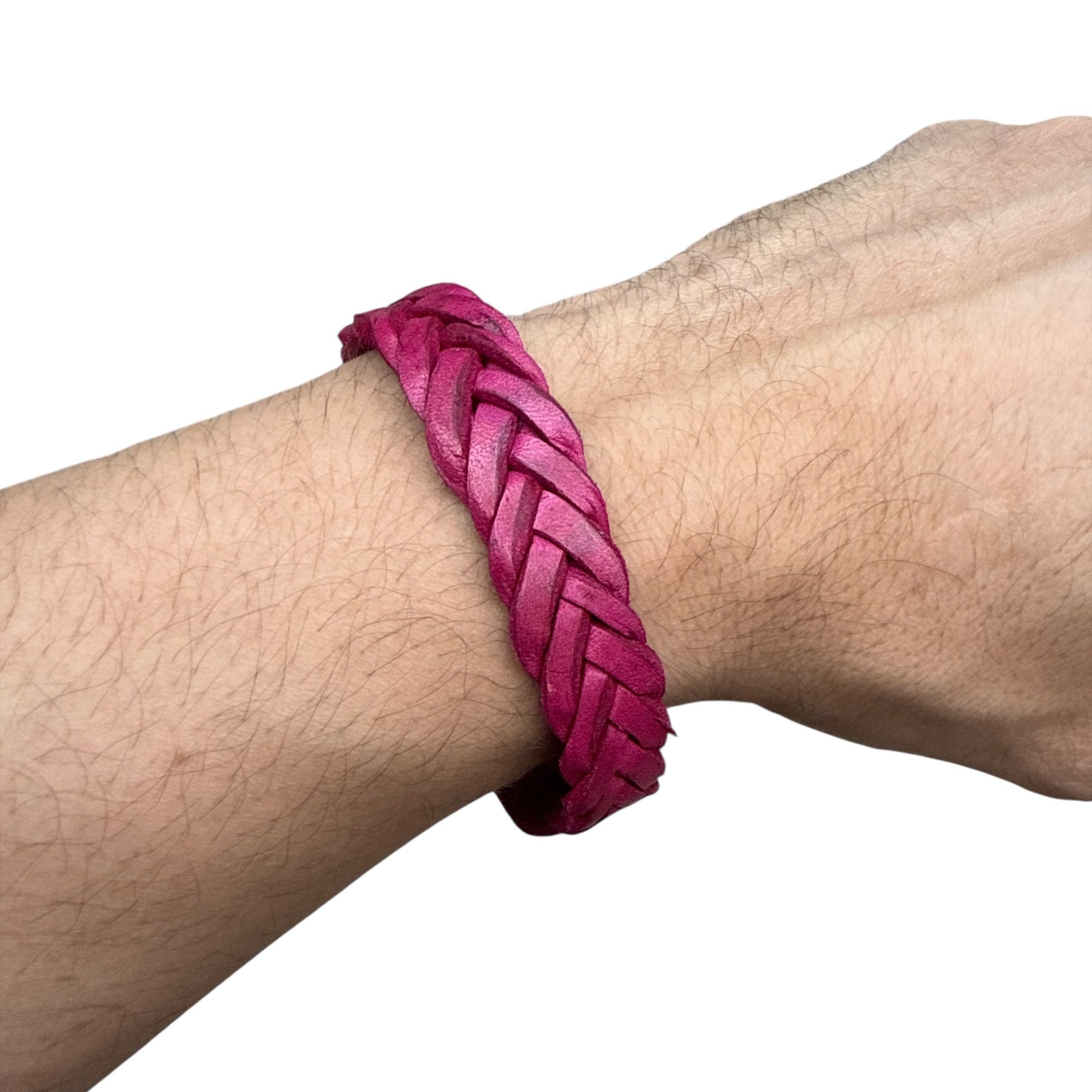 handmade braided leather bracelet in vibrant pink worn on wrist