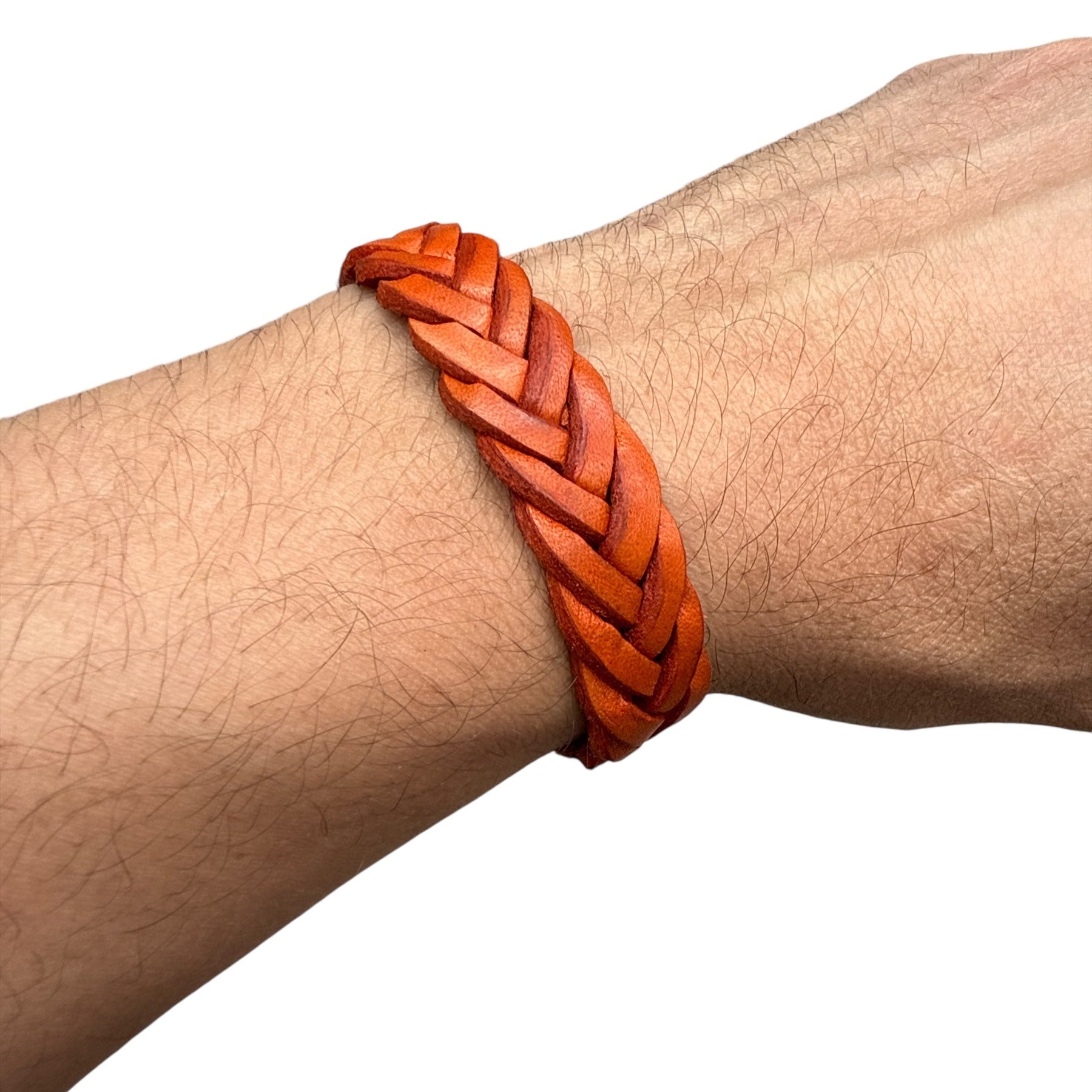 Handmade braided leather bracelet in reddish brown worn on wrist accessories