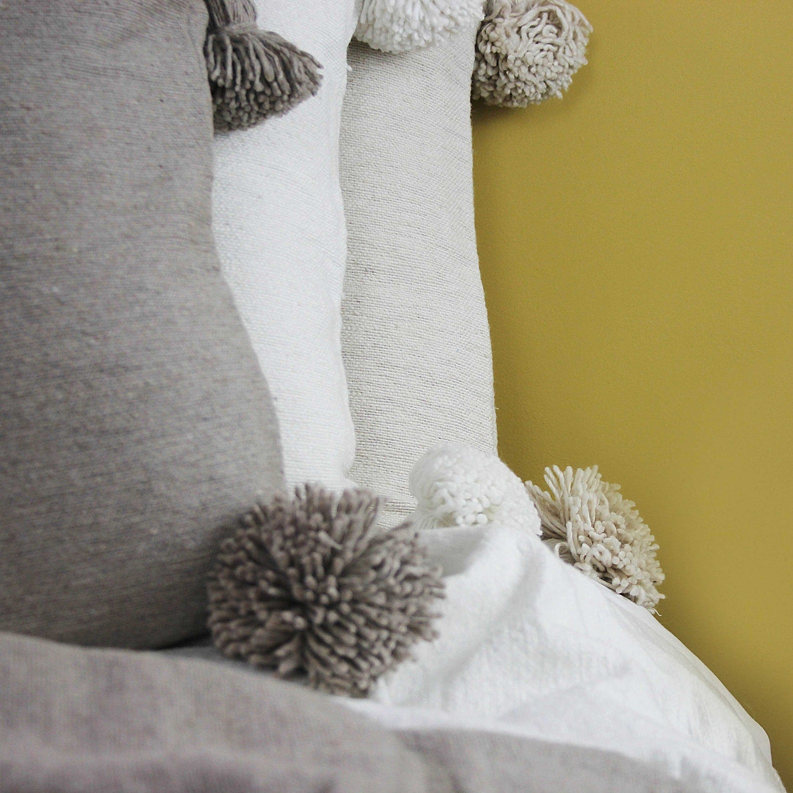 Neutral Pom Pom Cushions - Artisan Stories