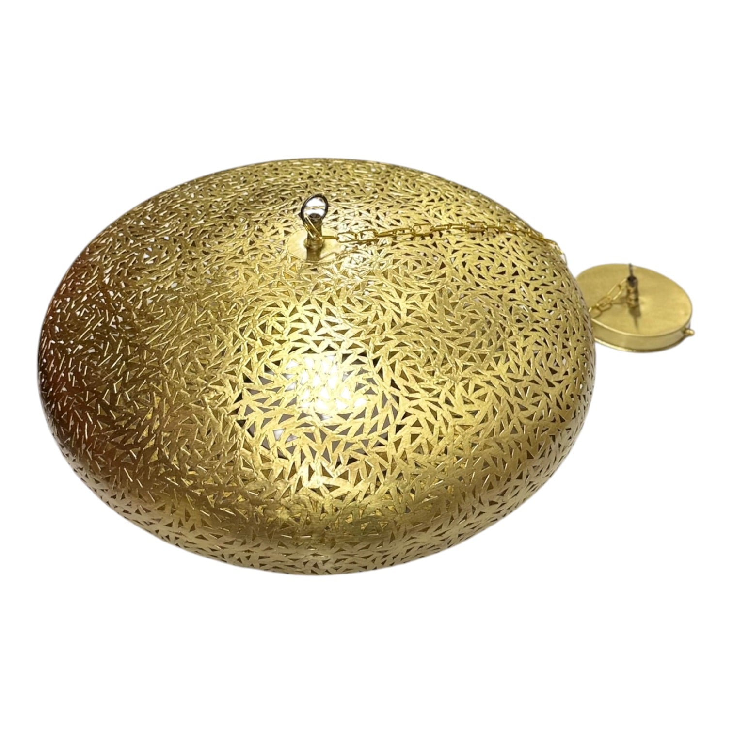 Decorative gold light fixture with intricate patterns on a white background