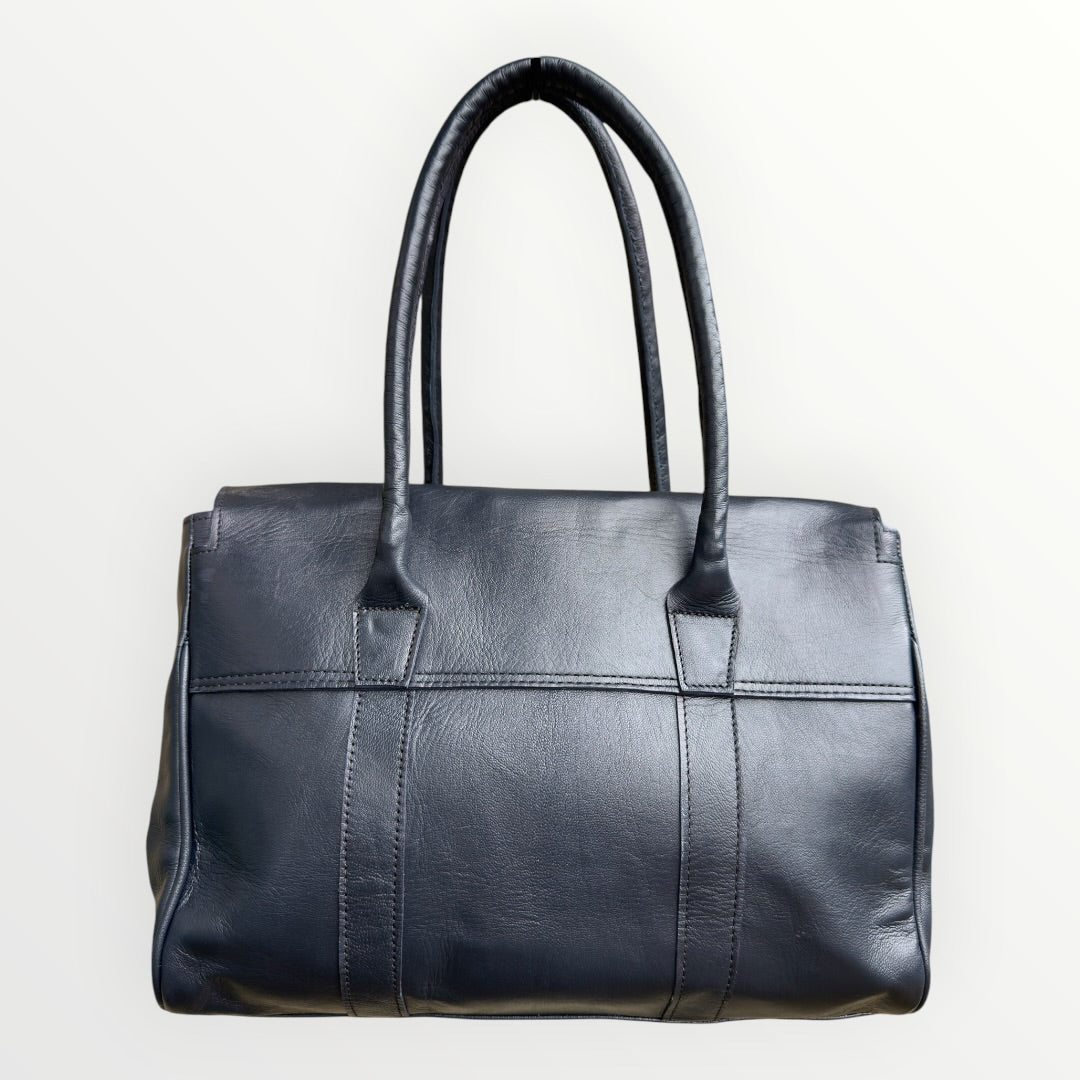 Black leather handbag on a white background