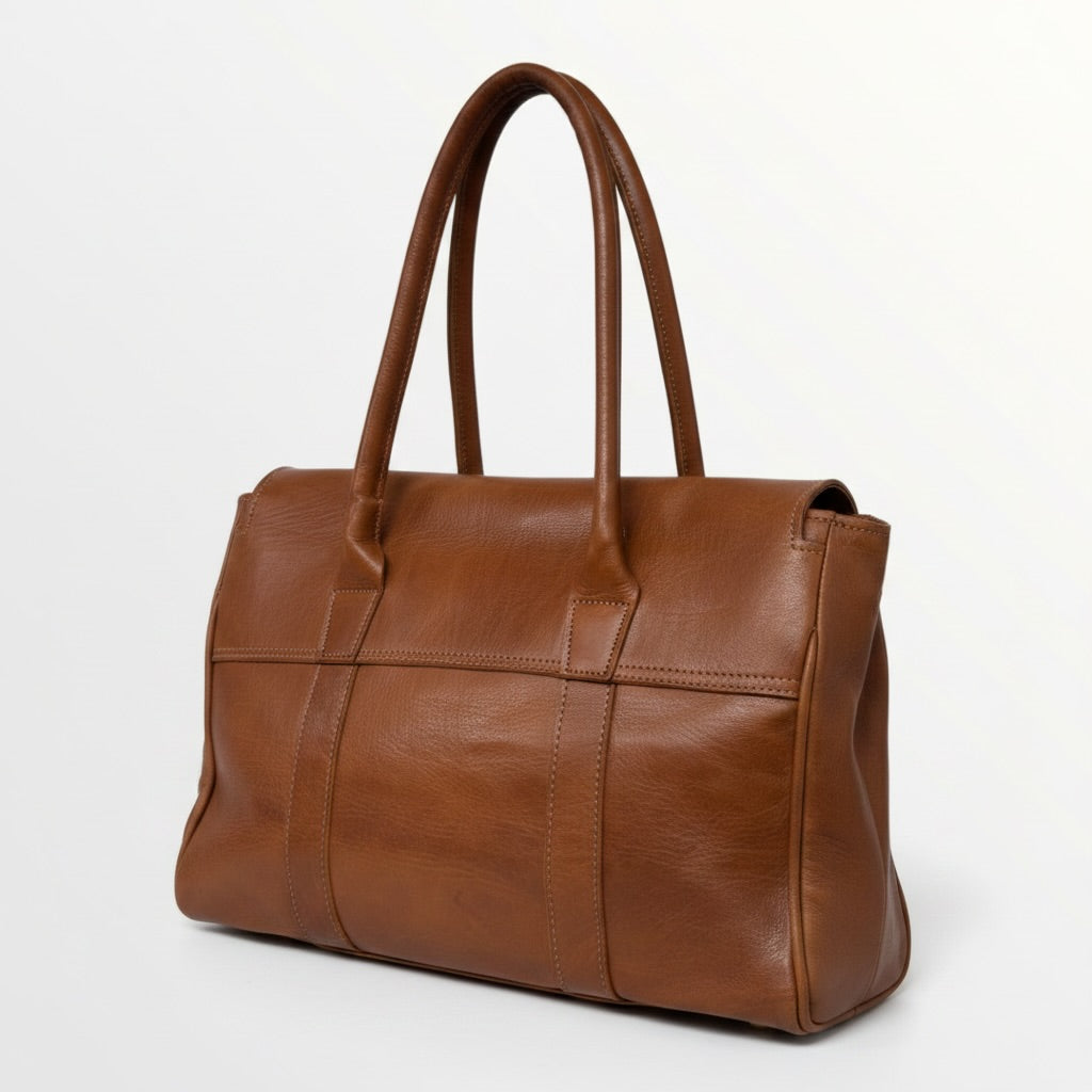 Brown leather handbag on a white background