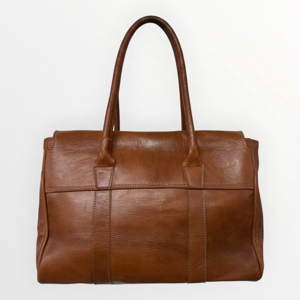 Brown leather handbag on a white background