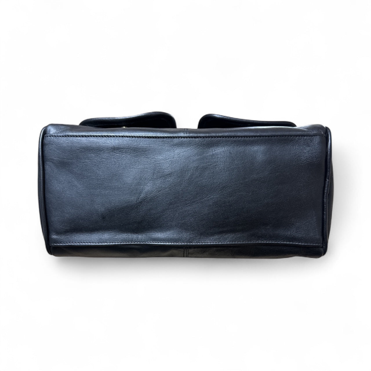 Black leather duffel bag on a white background
