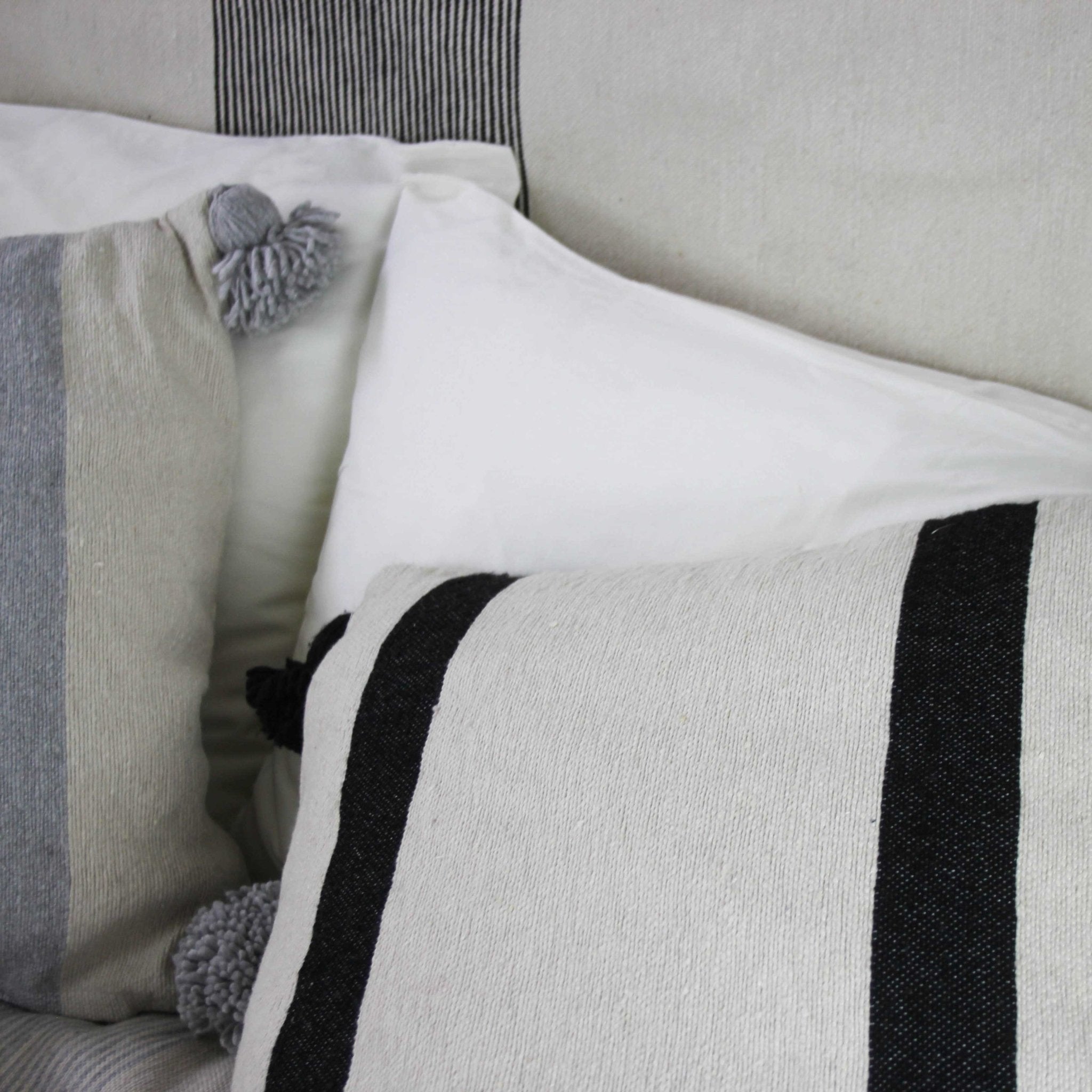 Cream Striped Pom Pom Cushions - Artisan Stories