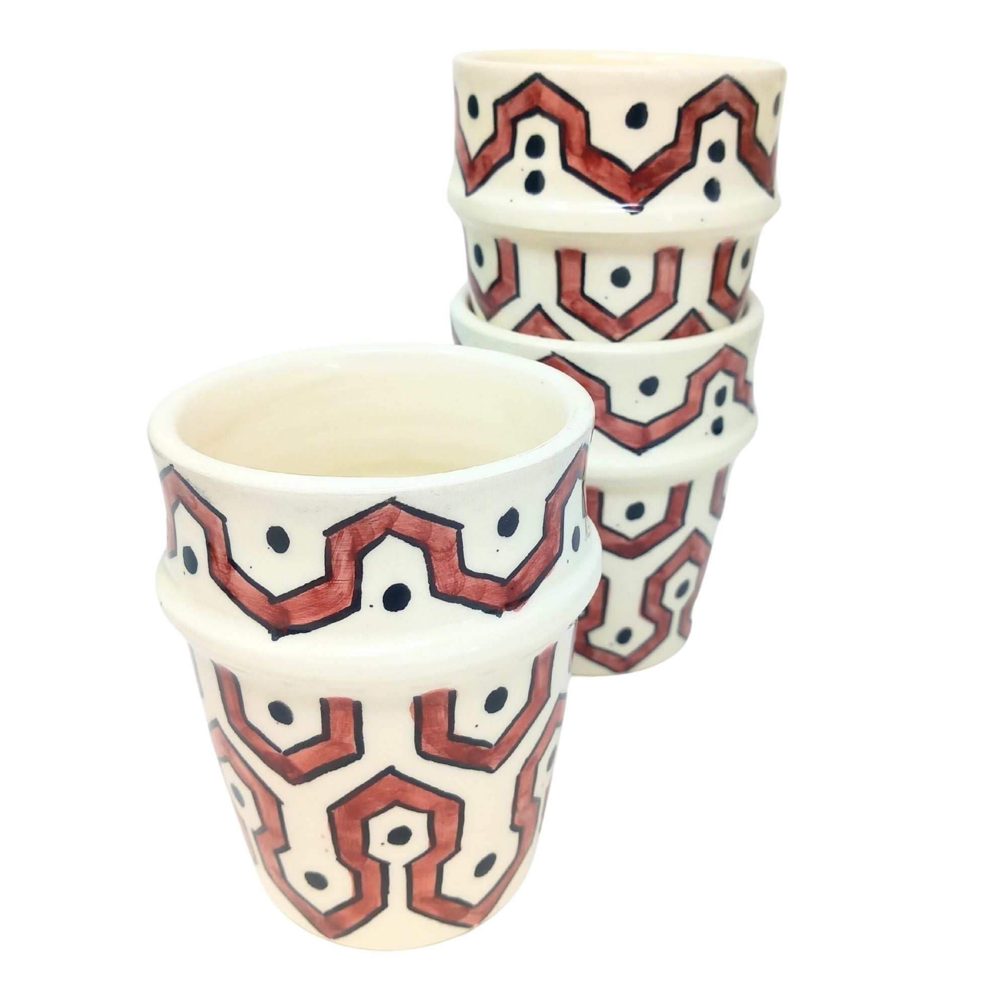picture of three ceramic cups which have been fully handcrafted by artisans. In Burgundy red.