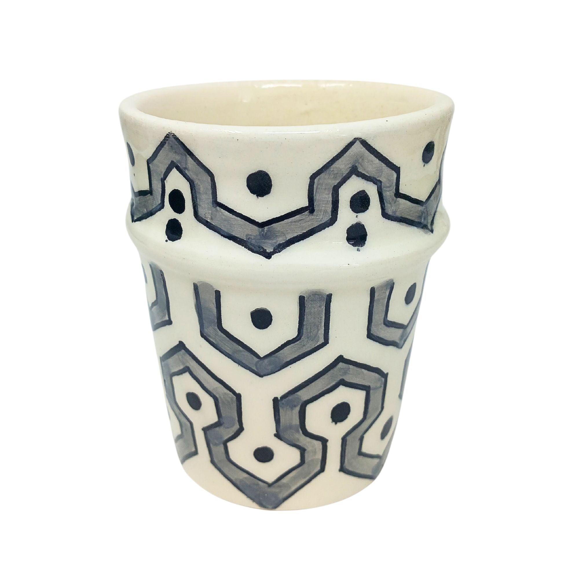 picture of a ceramic cup which has been fully handcrafted by artisans. In Grey.