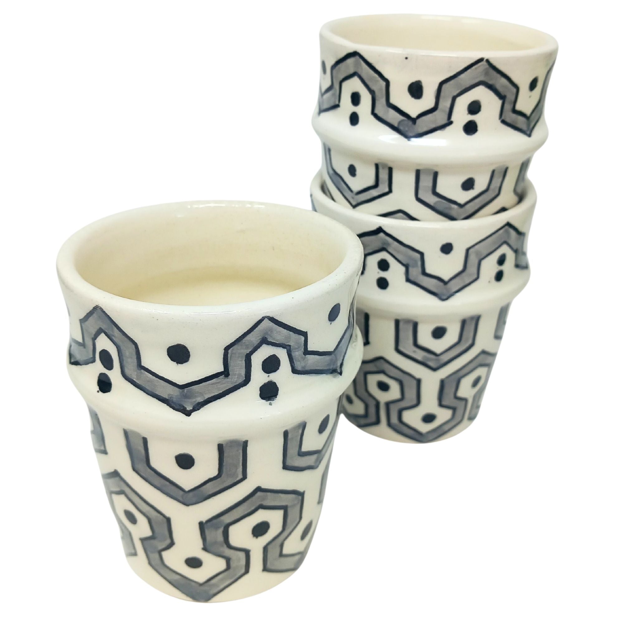 picture of three ceramic cups which have been fully handcrafted by artisans. In Grey.