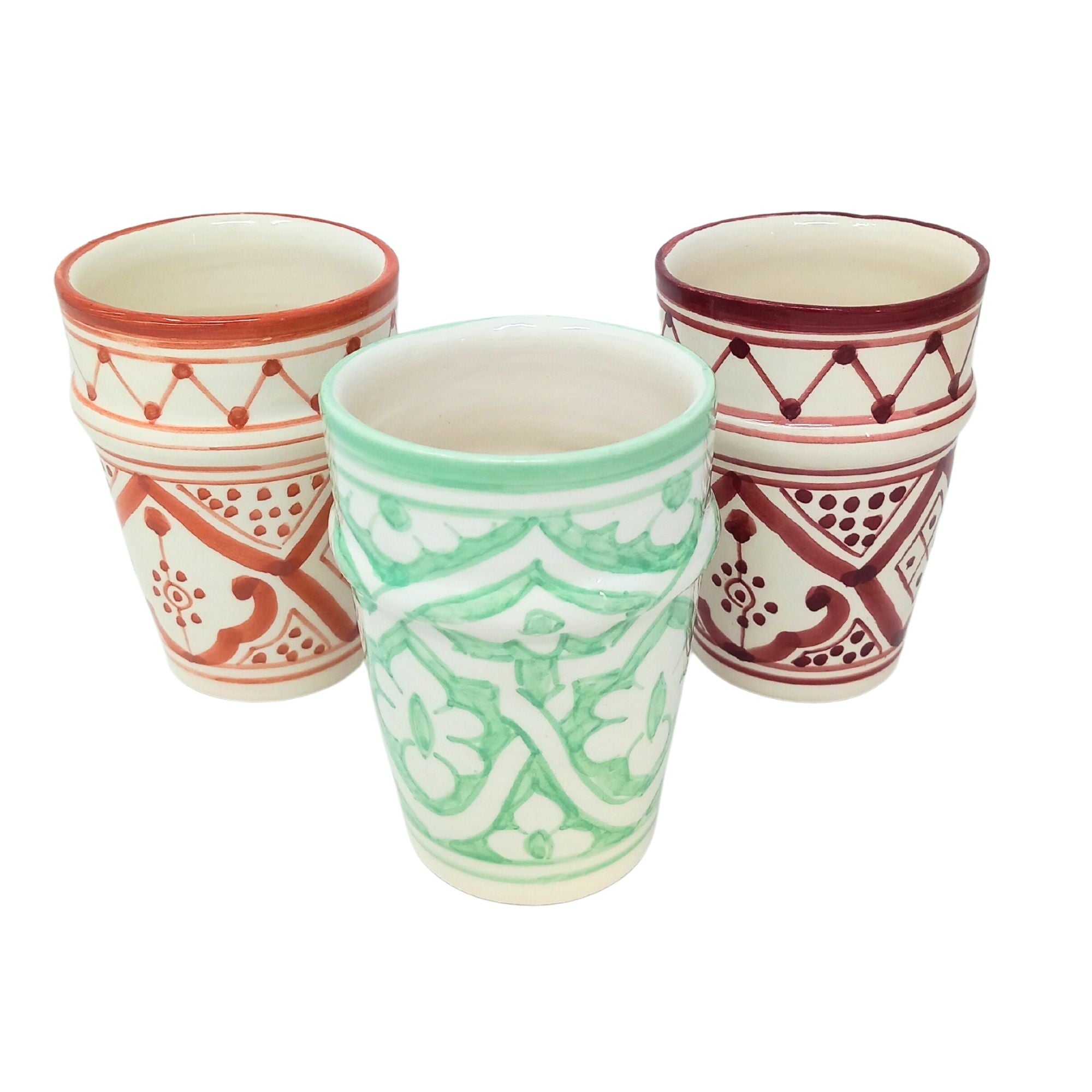 picture of handcrafted ceramic mugs in three colours: orange, mint green and burgundy red
