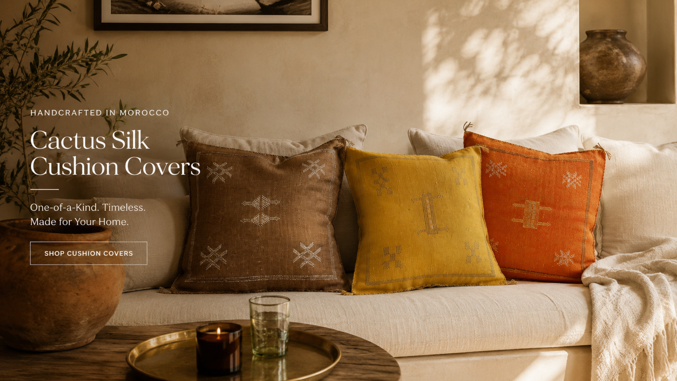 Cactus Silk Cushion Covers displayed on a sofa with decorative elements.