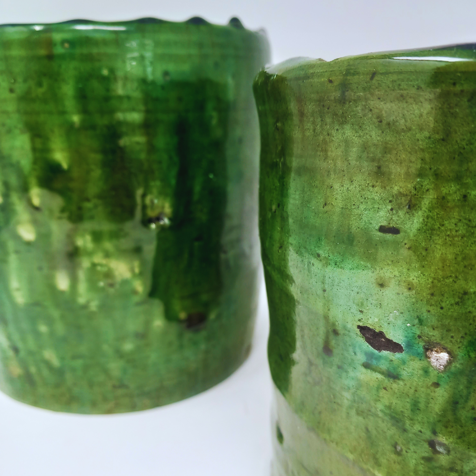 picture of two tamegroute pots in dark green hues closeup