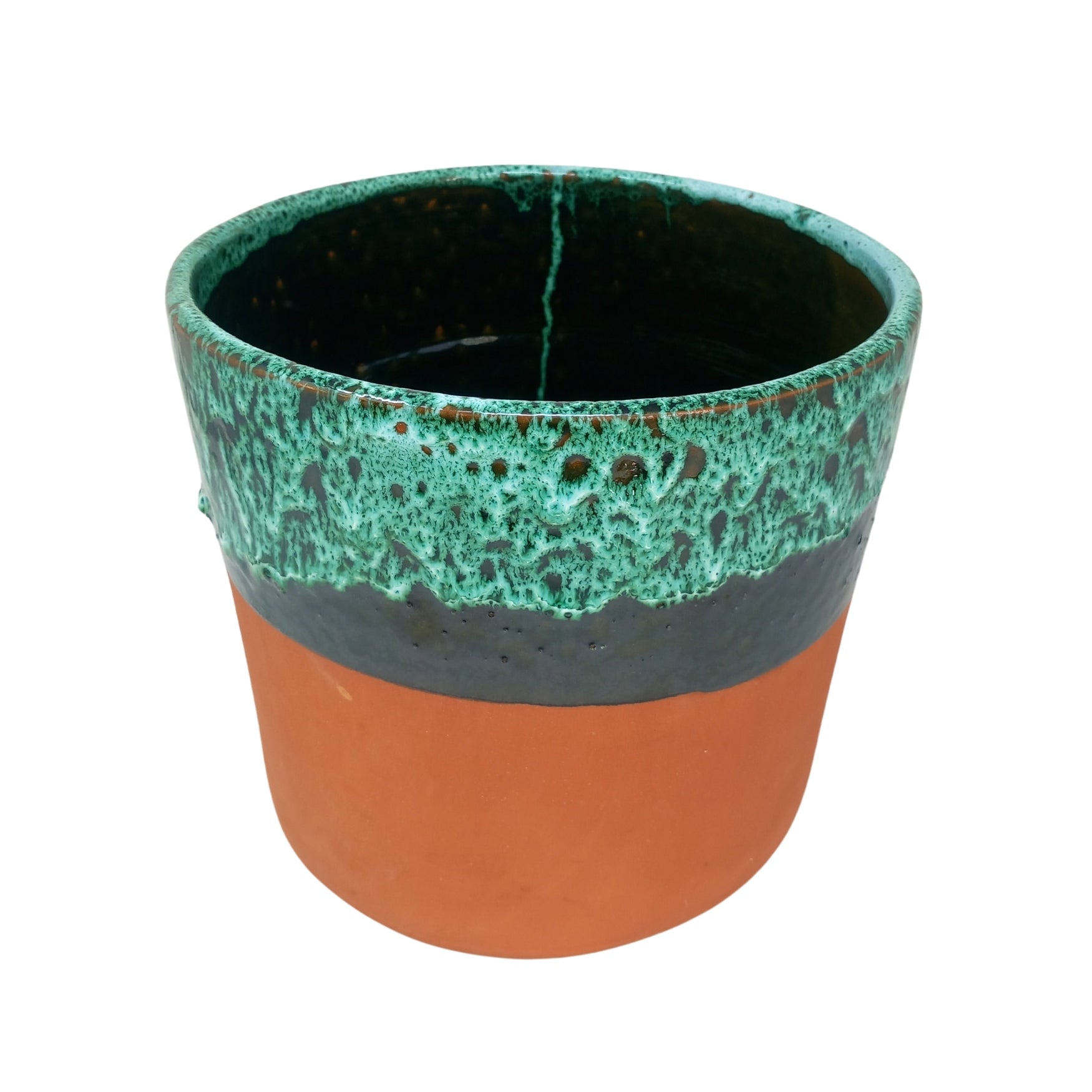 picture of handcrafted terracotta overpot with a green drip design