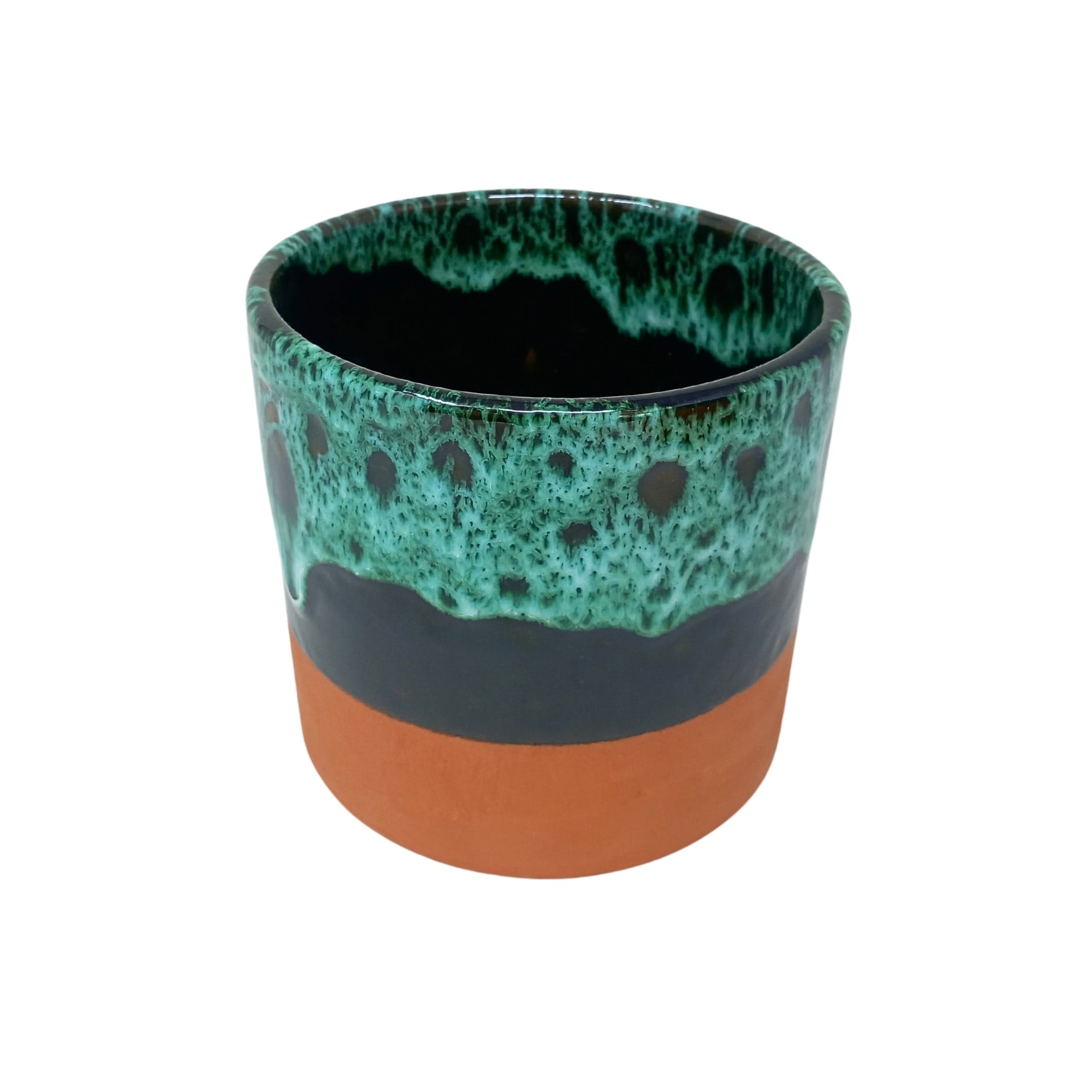 picture of handcrafted terracotta overpot with a green drip design