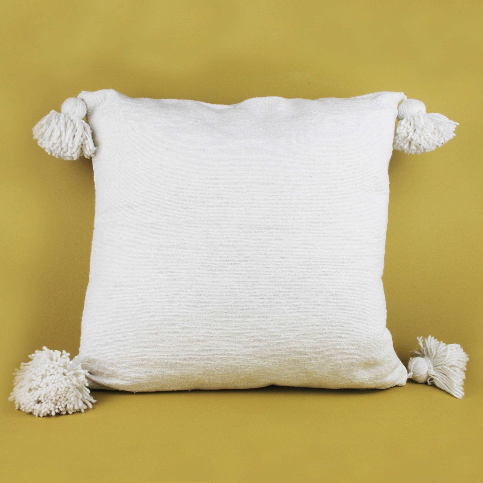 White cushions hot sale with pom poms